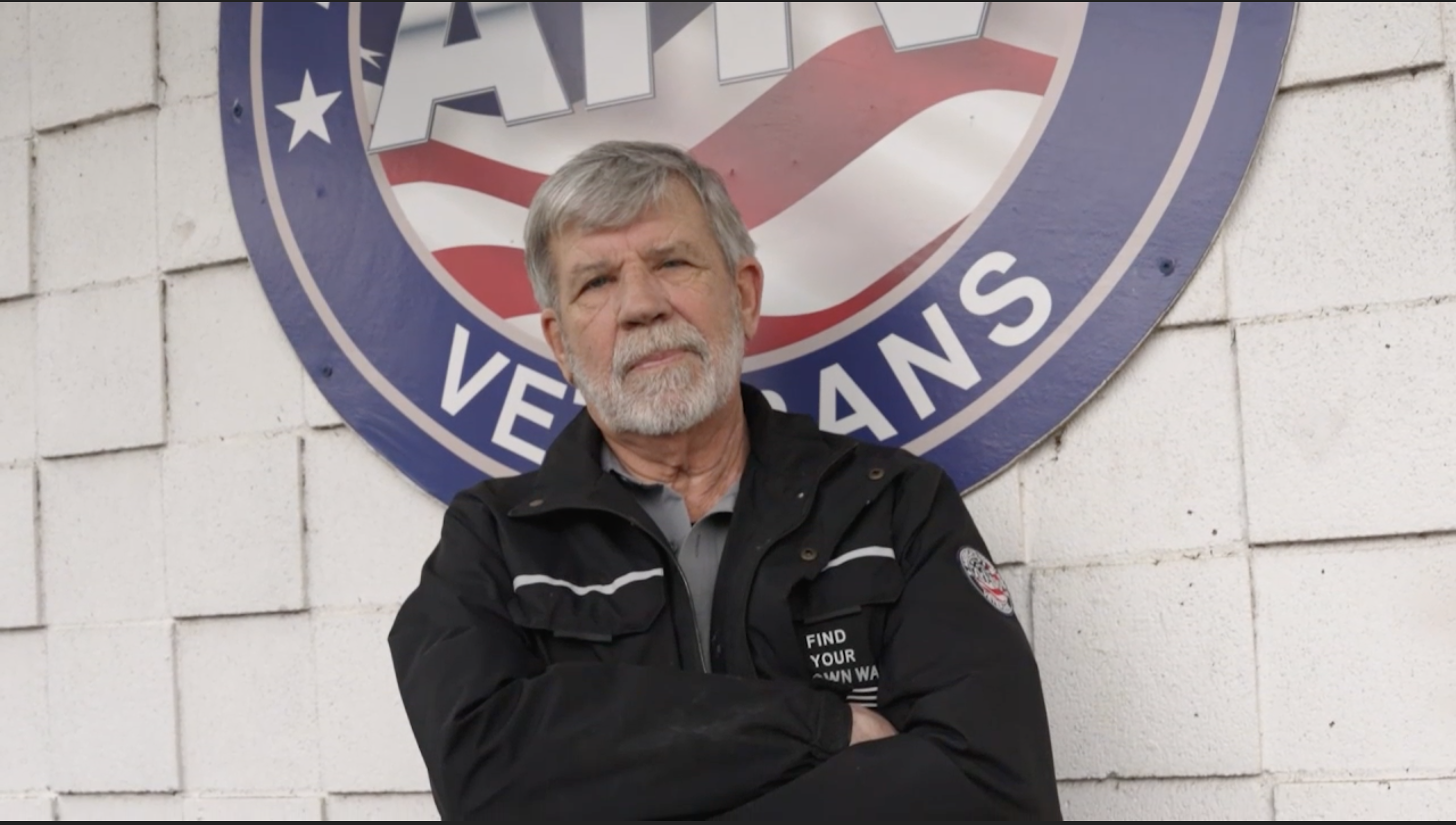 Randall Britt in front of AHVets Veterans sign